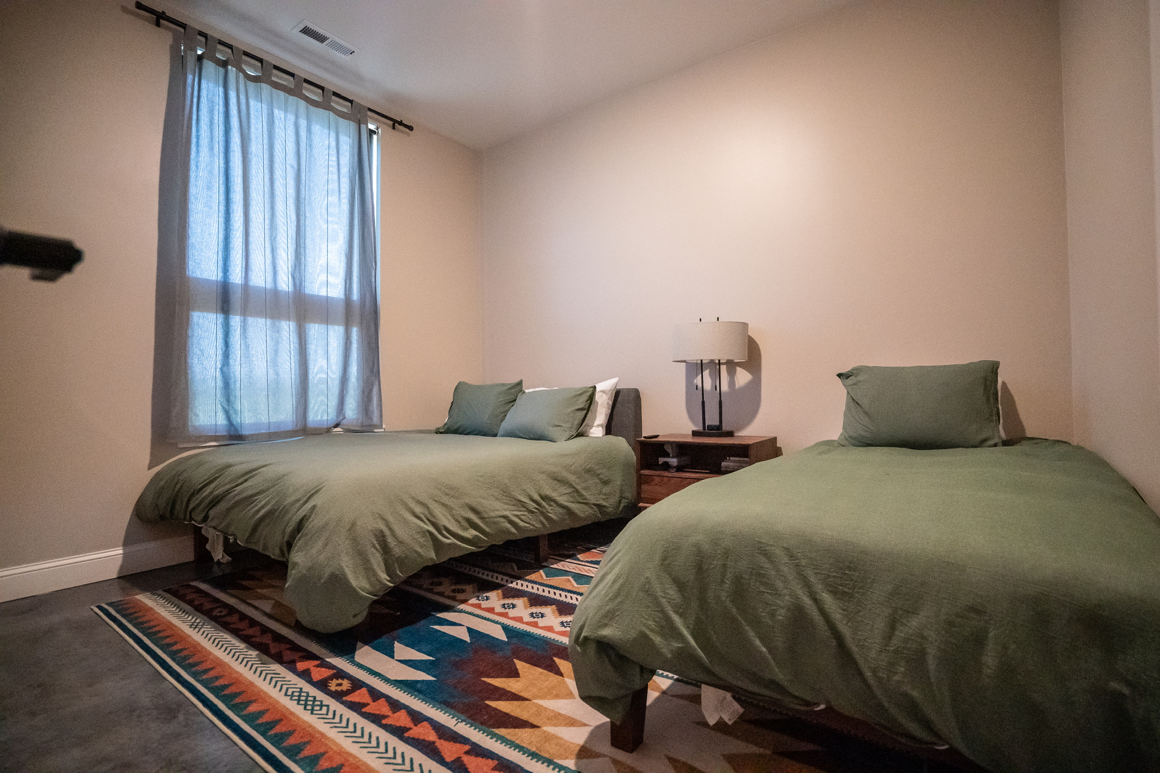 Guest bedroom with two beds at 3 Mile Cabin