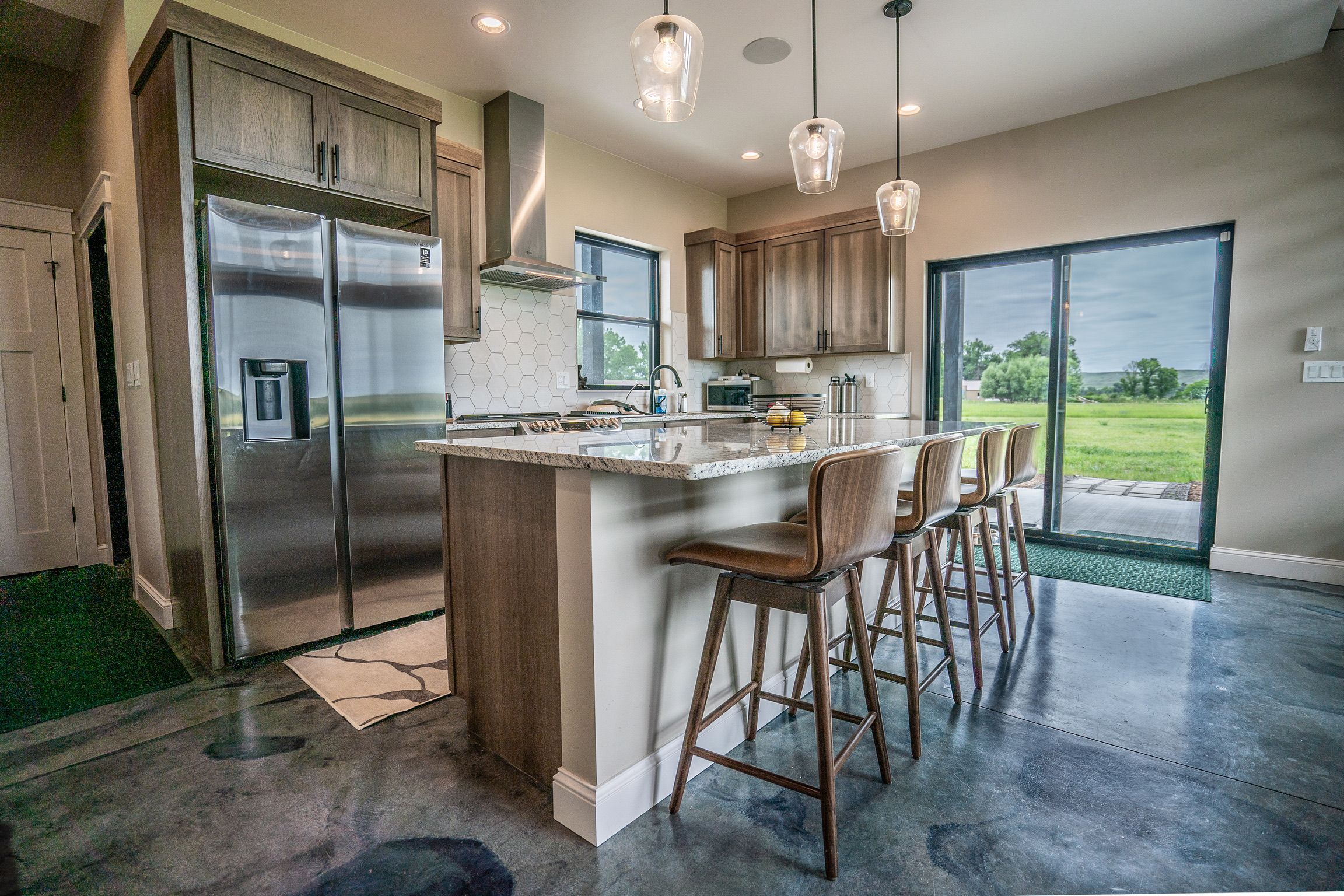 Kitchen with island and pendant lighting at 3 Mile Cabin