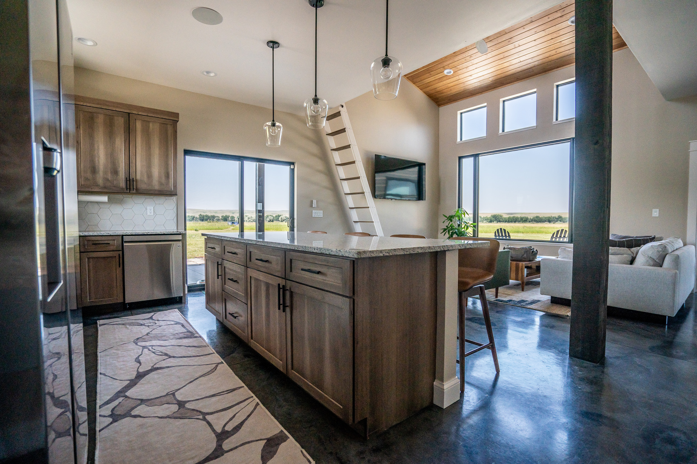 Wide view of the kitchen, dining, and living areas at 3 Mile Cabin